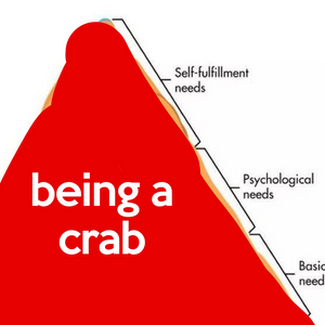 A pyramid split into Self-fulfillment needs, Psychological needs and Basic need. The pyramid is coloured entirely in red, with just the words 'being a crab'.